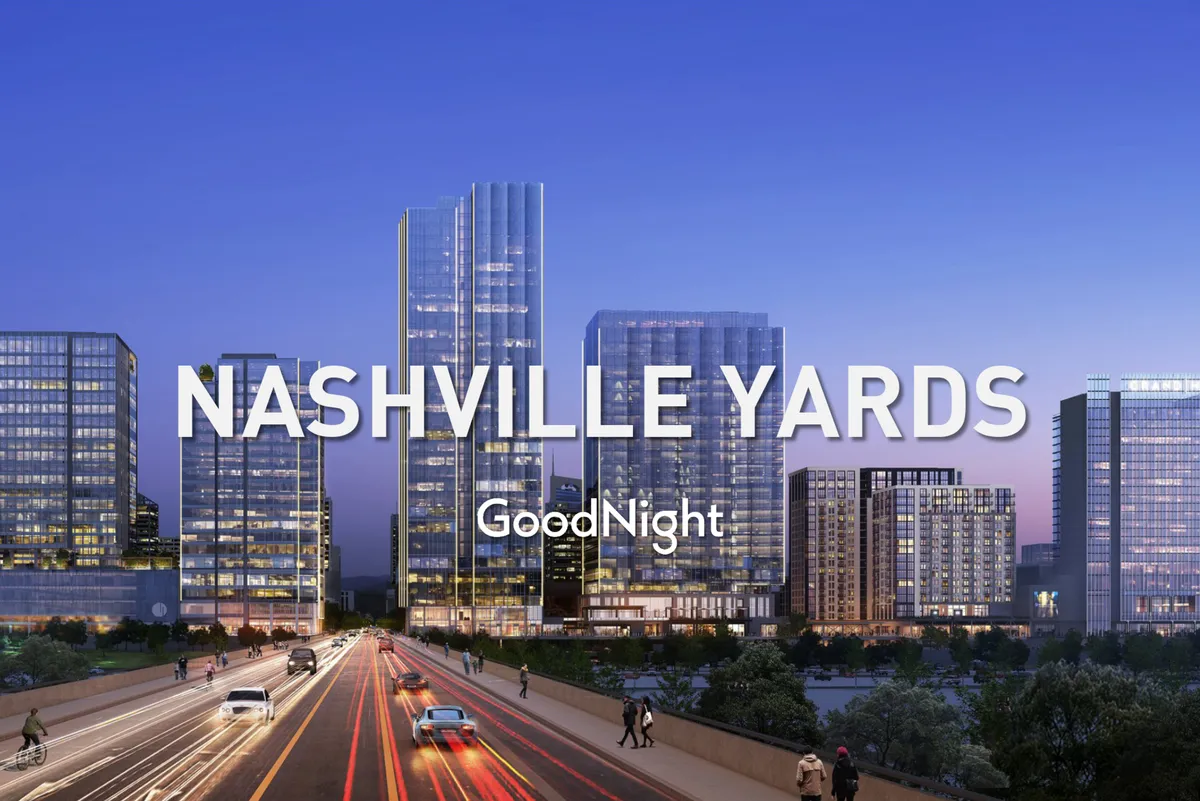 A vibrant, energetic city view with modern skyscrapers illuminated in the evening, busy roads, and sparkling city lights. The atmosphere feels alive, reflecting the excitement of urban nightlife and opportunities for romantic evening strolls or dining nearby.
