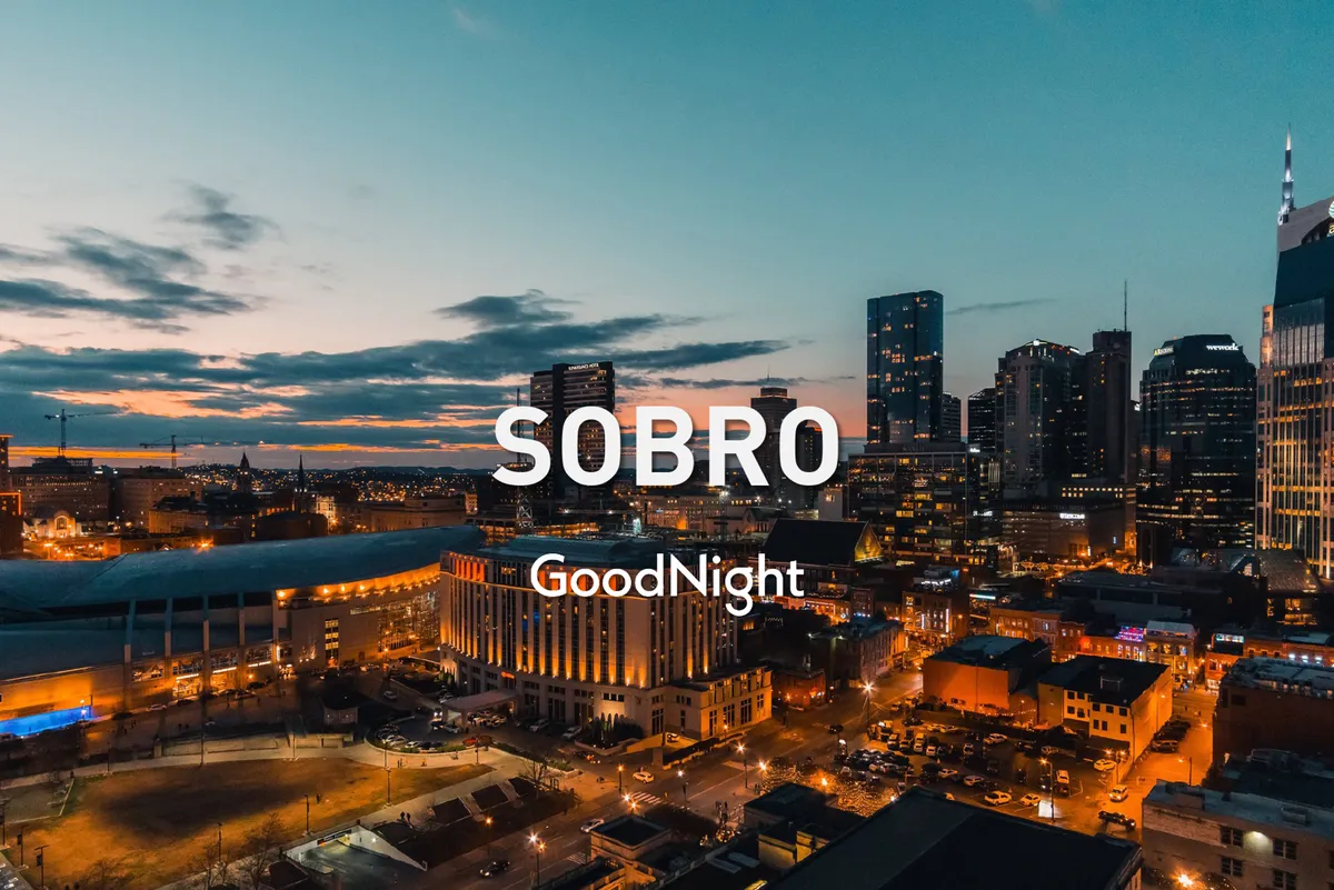 A captivating sunset view of the Nashville city skyline, highlighting the urban architecture and the city’s vibrant atmosphere as night approaches. The scene invites exploration of the city after work hours.
